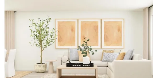 a living room with furniture and a potted plant