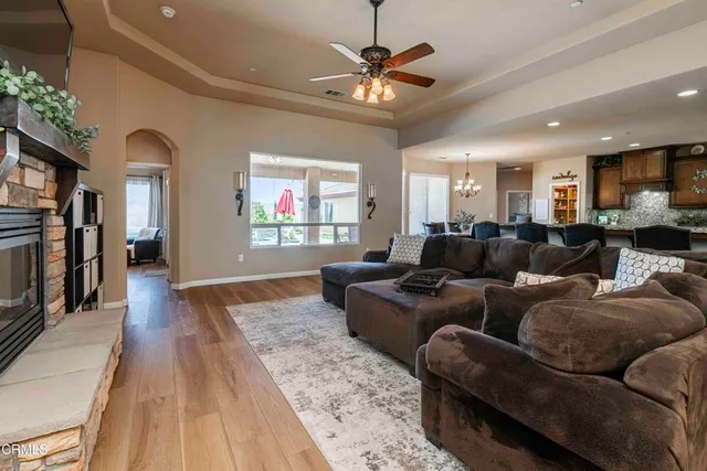 a kitchen with stainless steel appliances granite countertop a stove microwave and sink