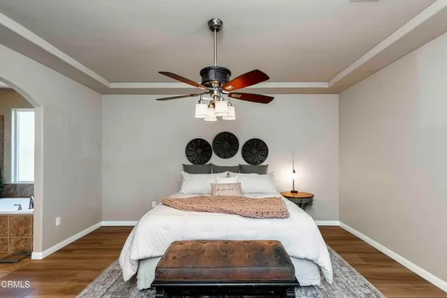 a view of walk in closet with clothes