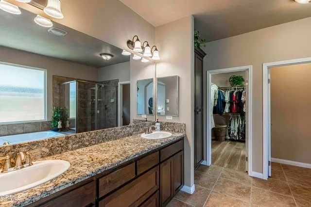 a bedroom with furniture and a book shelf