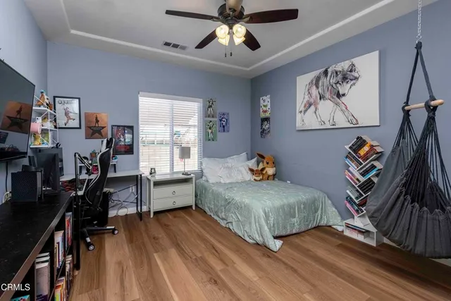 a bedroom with bed and window