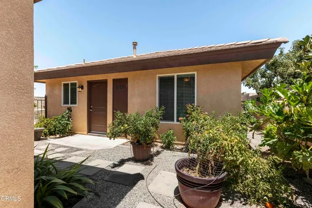 a room with a bed and a mirror