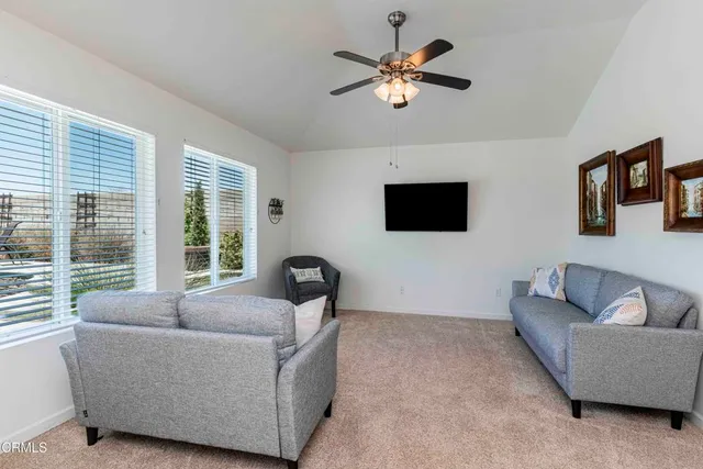a view of swimming pool with sitting area