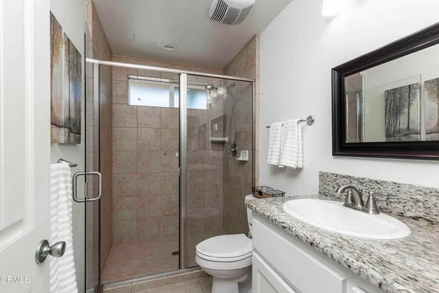 a view of a house with swimming pool and sitting area