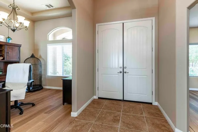 a room with a table and a bookshelf