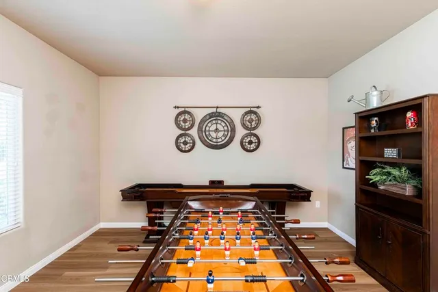 a living room with fireplace furniture and a flat screen tv