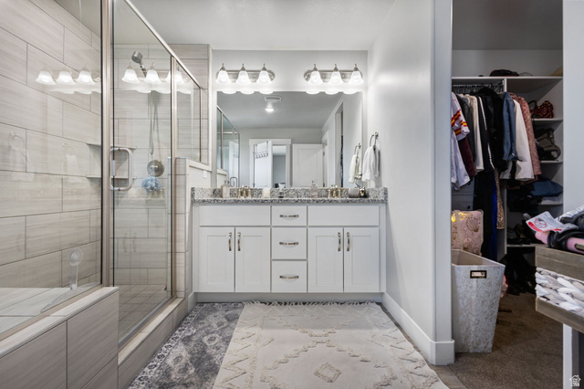 7889 Bristlecone Road Eagle Mountain, UT 84005 - Photo 24 of 42 Dual vanity with white cabinetry and granite countertops
