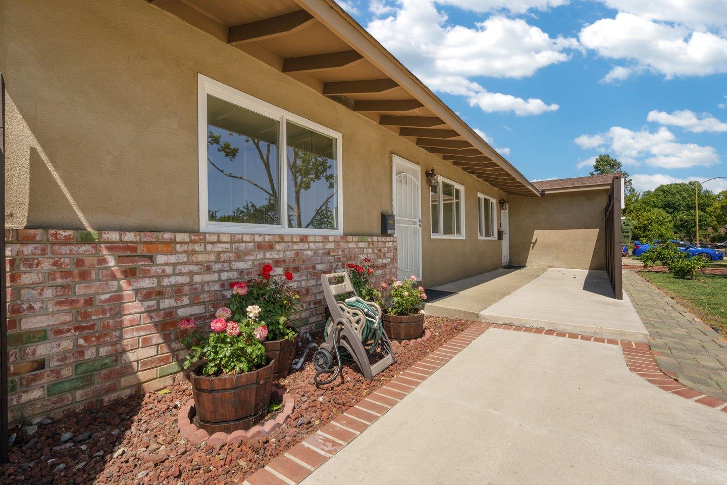 1107 Bismarck Drive Campbell, CA 95008 - Photo 3 of 21 a house with flowers in front of it