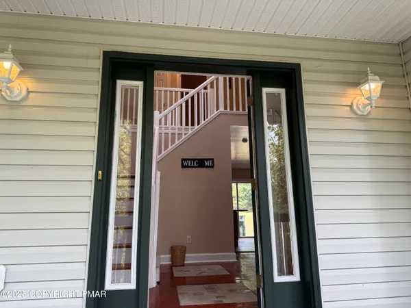 a kitchen with stainless steel appliances granite countertop a sink a stove and a microwave