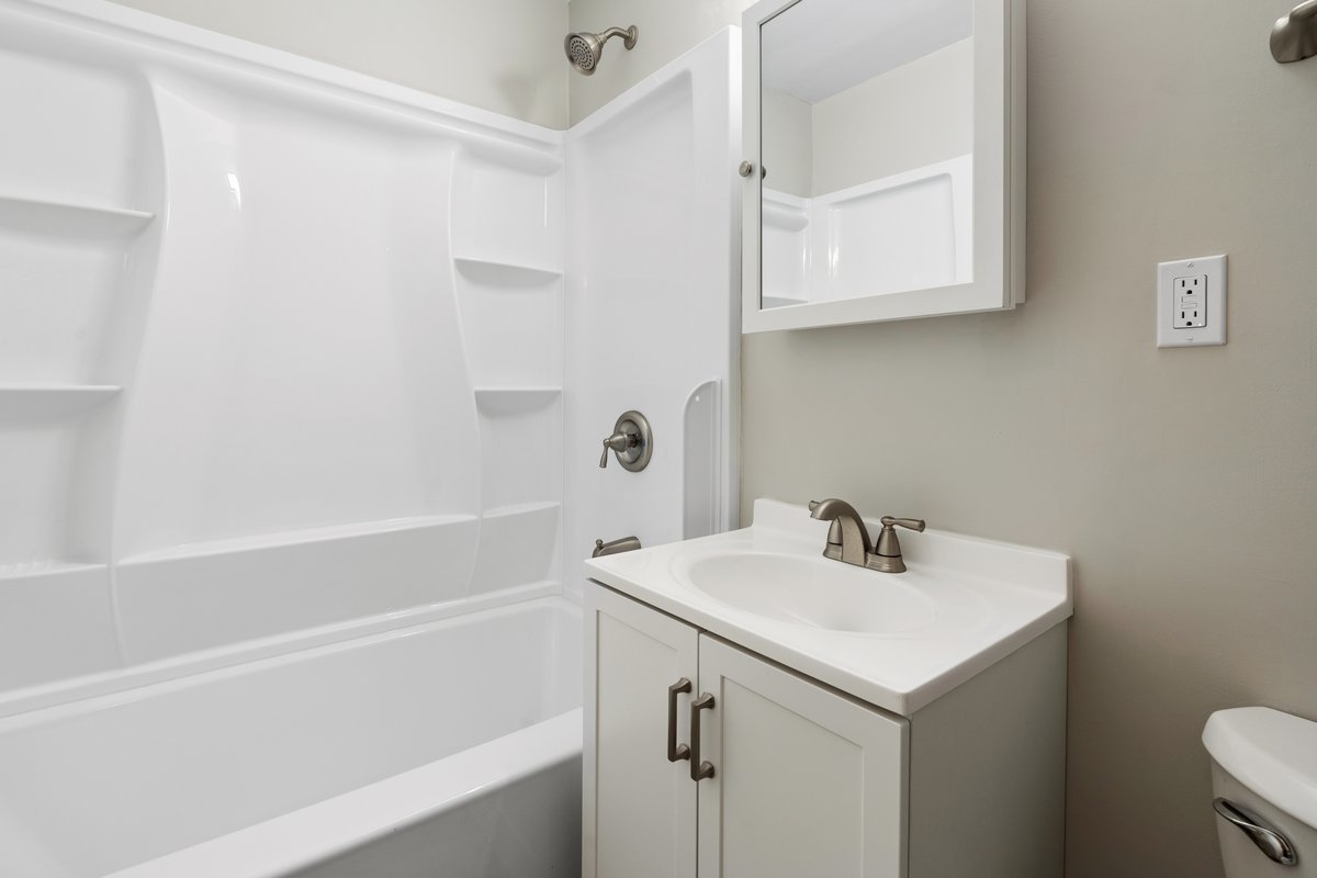 59 Wren Road Carpentersville, IL 60110 - Photo 11 of 19 a bathroom with a sink a toilet and shower
