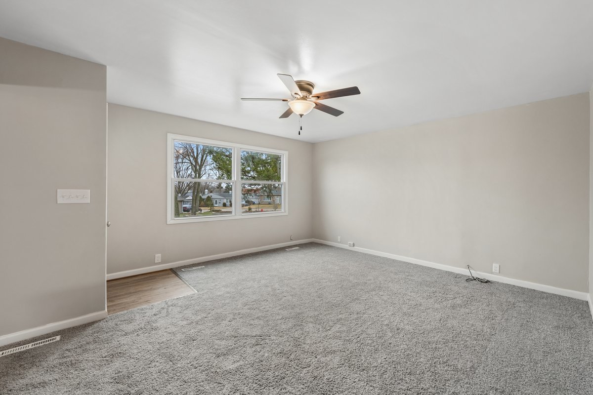 59 Wren Road Carpentersville, IL 60110 - Photo 14 of 19 an empty room with windows and fan