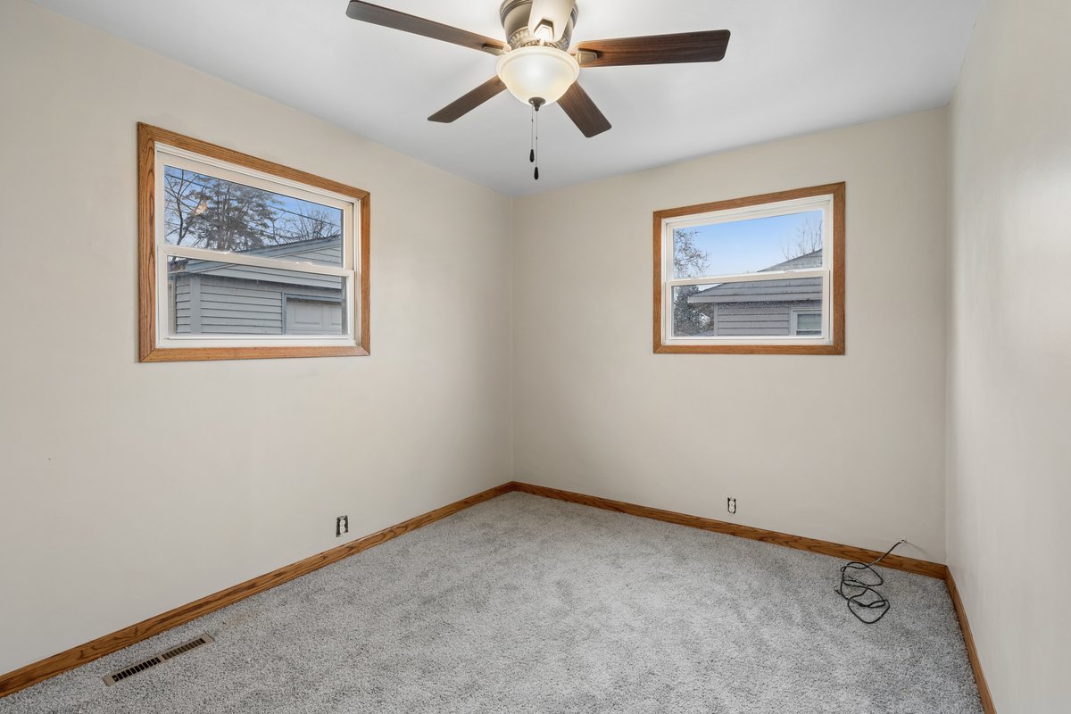 59 Wren Road Carpentersville, IL 60110 - Photo 15 of 19 an empty room with windows and fan