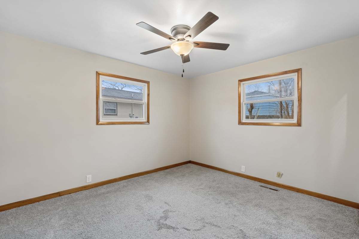 59 Wren Road Carpentersville, IL 60110 - Photo 16 of 19 a view of an empty room with a window