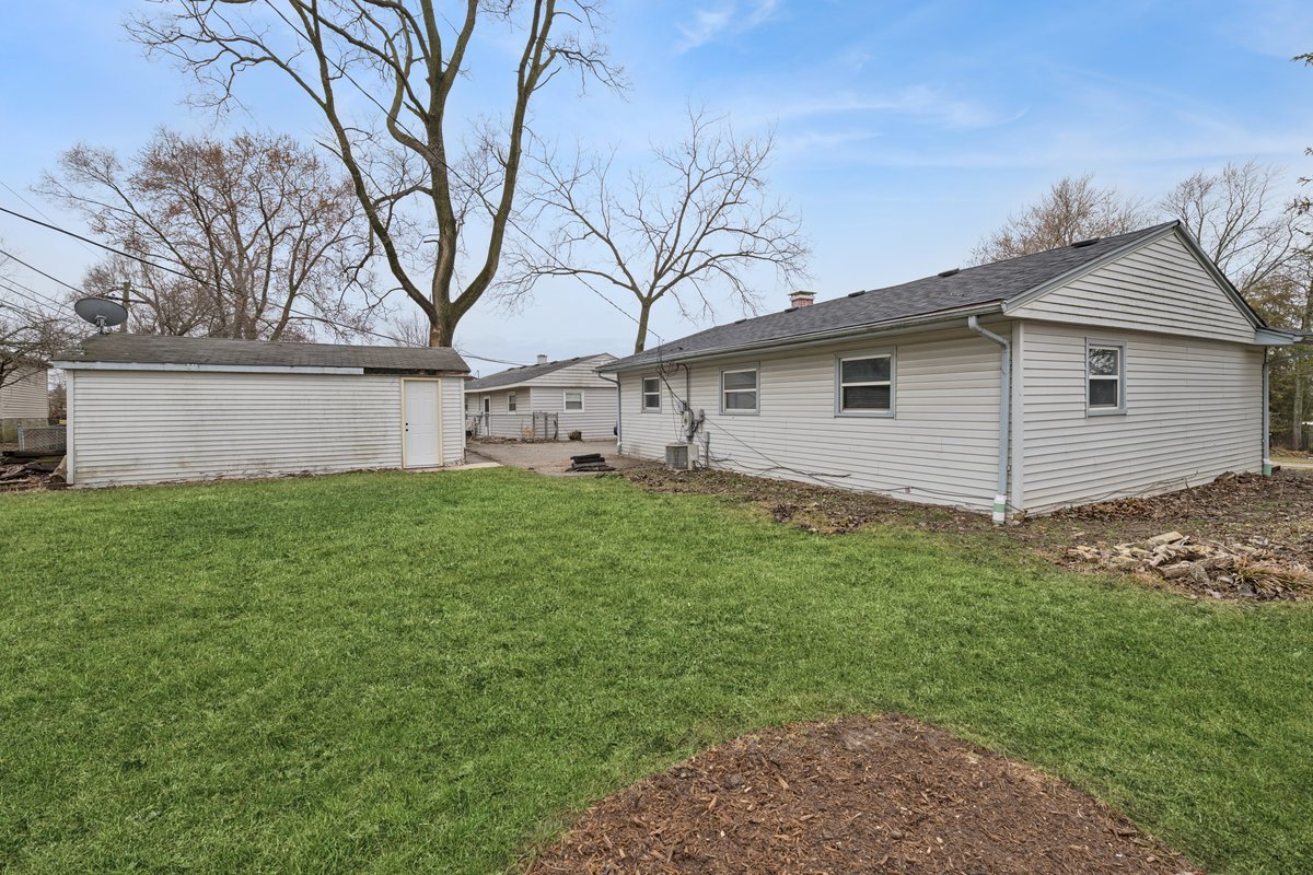 59 Wren Road Carpentersville, IL 60110 - Photo 17 of 19 a view of a house with a yard