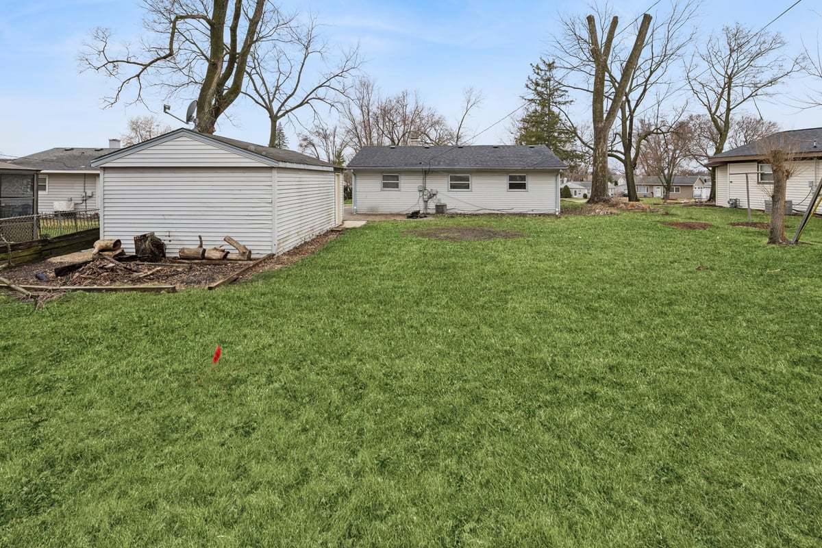 59 Wren Road Carpentersville, IL 60110 - Photo 18 of 19 a front view of a house with garden