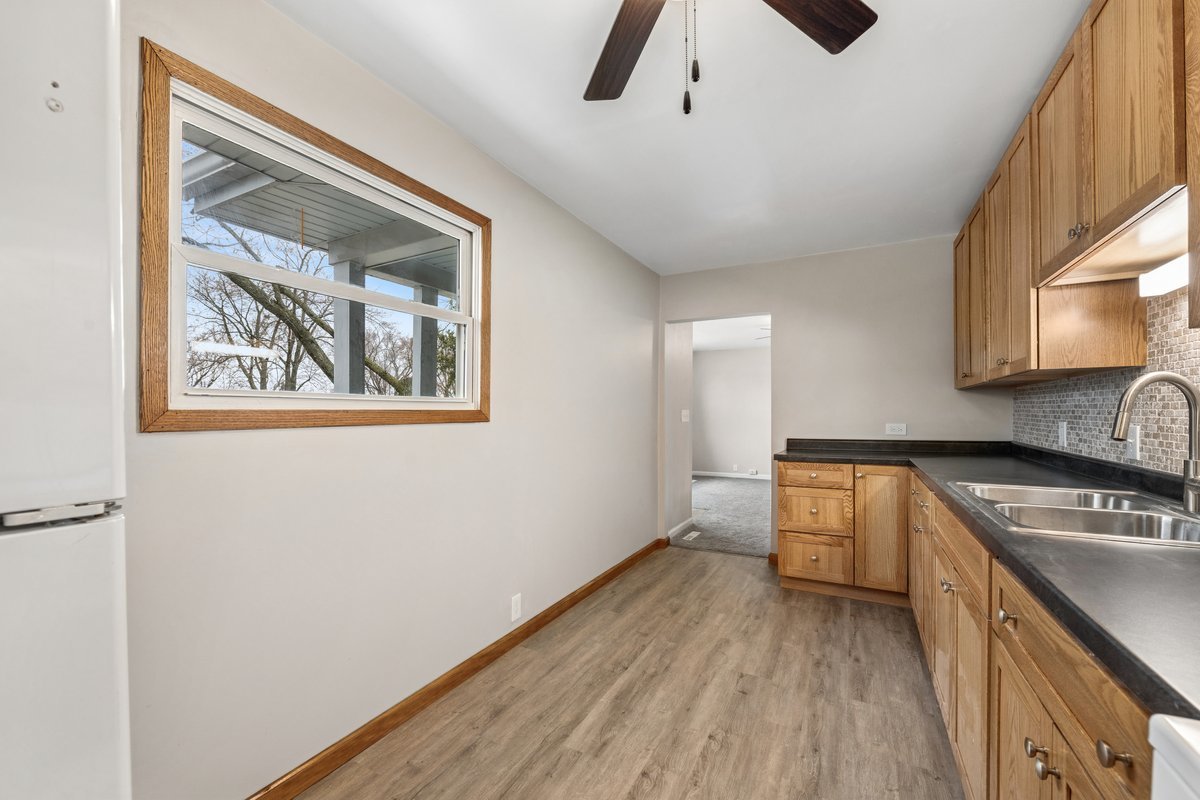 59 Wren Road Carpentersville, IL 60110 - Photo 5 of 19 a kitchen with a refrigerator and a stove