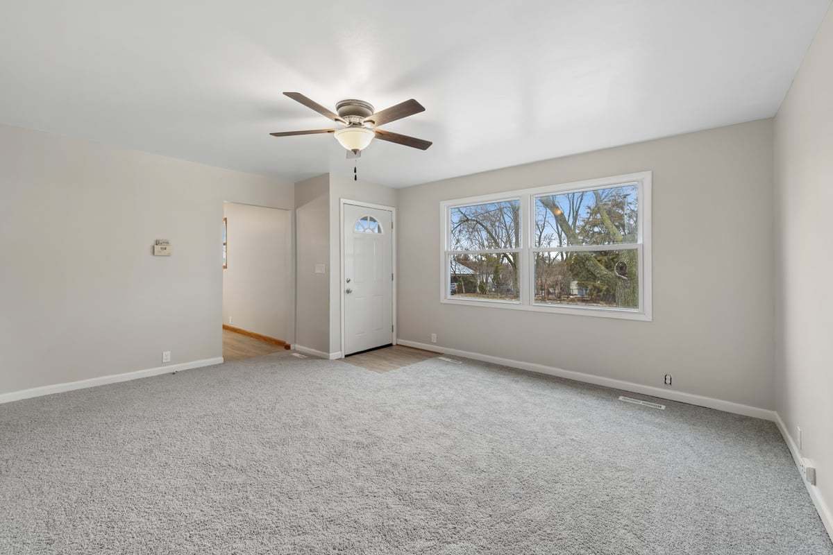 59 Wren Road Carpentersville, IL 60110 - Photo 8 of 19 wooden floor in an empty room with a window