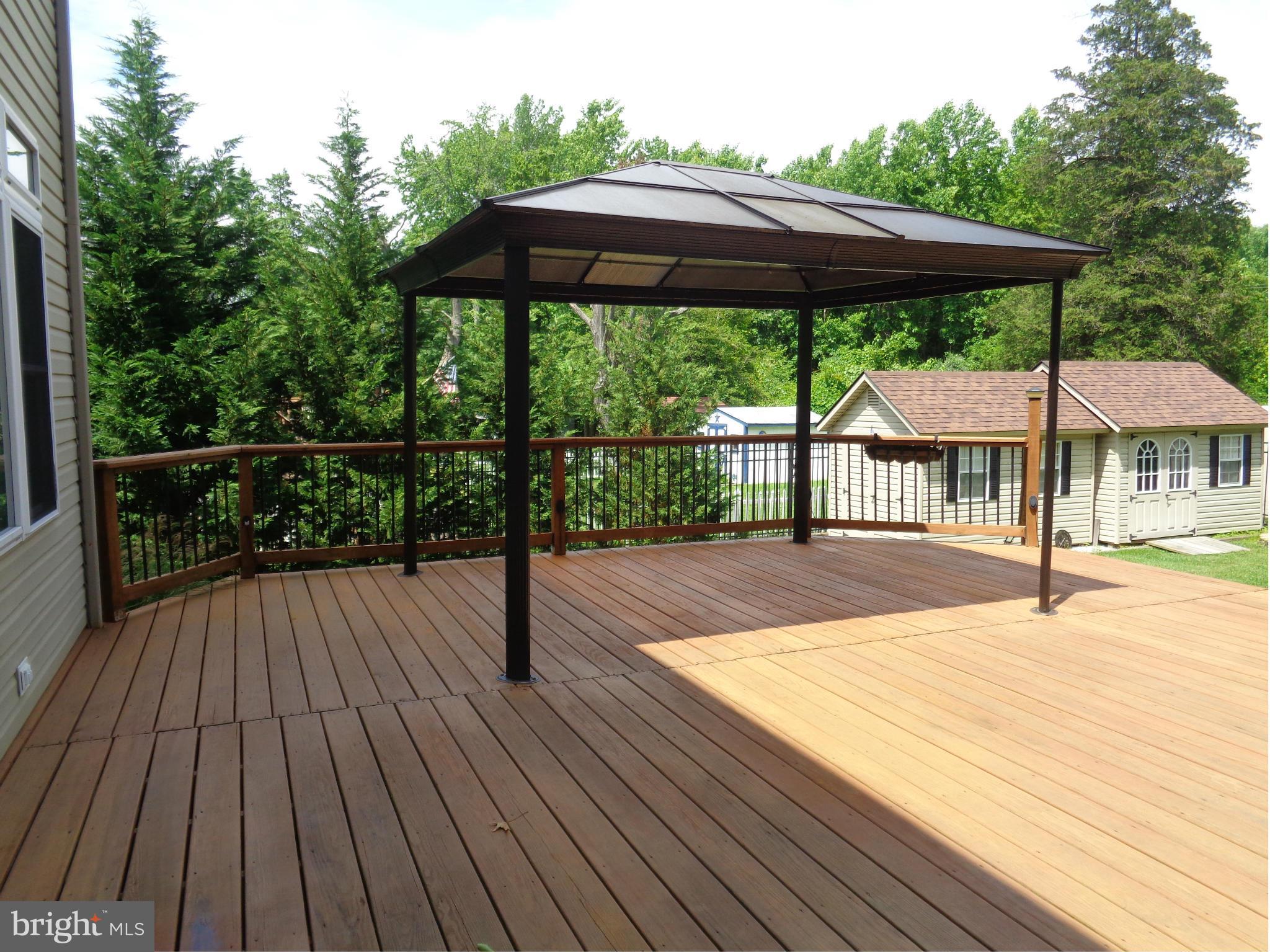 1113 Cedar Creek Road Baltimore, MD 21221 - Photo 25 of 28 LARGE DECK W/CANOPY AND TWO AMISH SHEDS