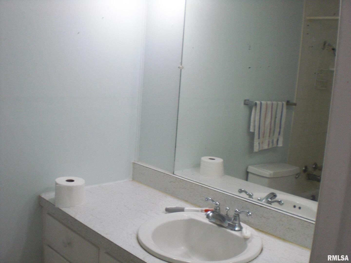 1109 Marion Street Carterville, IL 62918 - Photo 7 of 16 a bathroom with a sink and a toilet