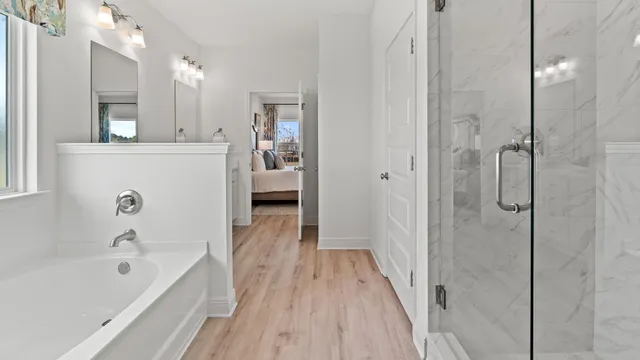 a bathroom with a glass shower door