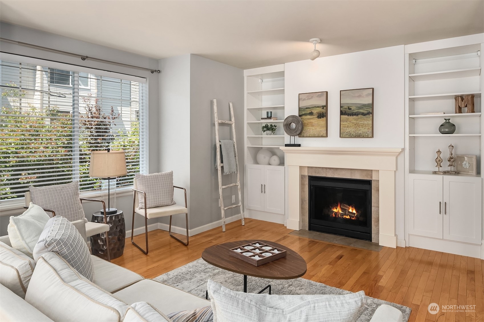 a living room with furniture and a fireplace