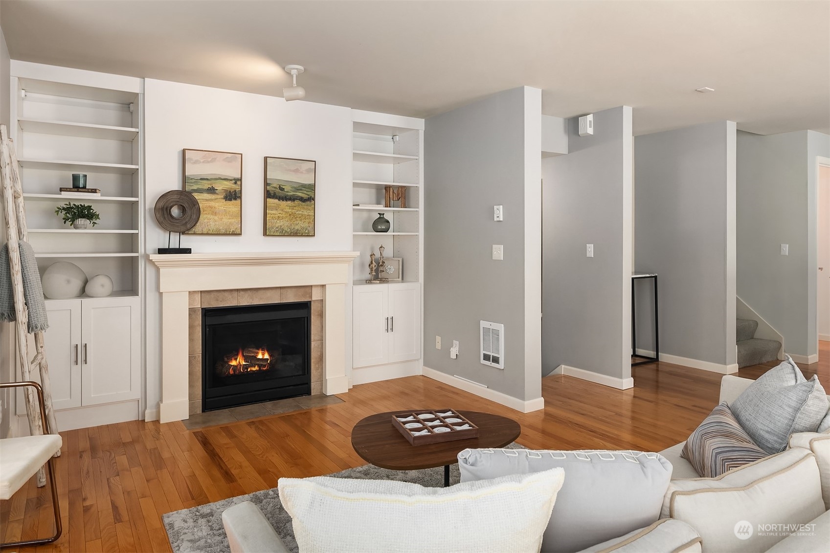 8517 Interlake Avenue North, Unit A Seattle, WA 98103 - Photo 3 of 20 a living room with furniture and a fireplace
