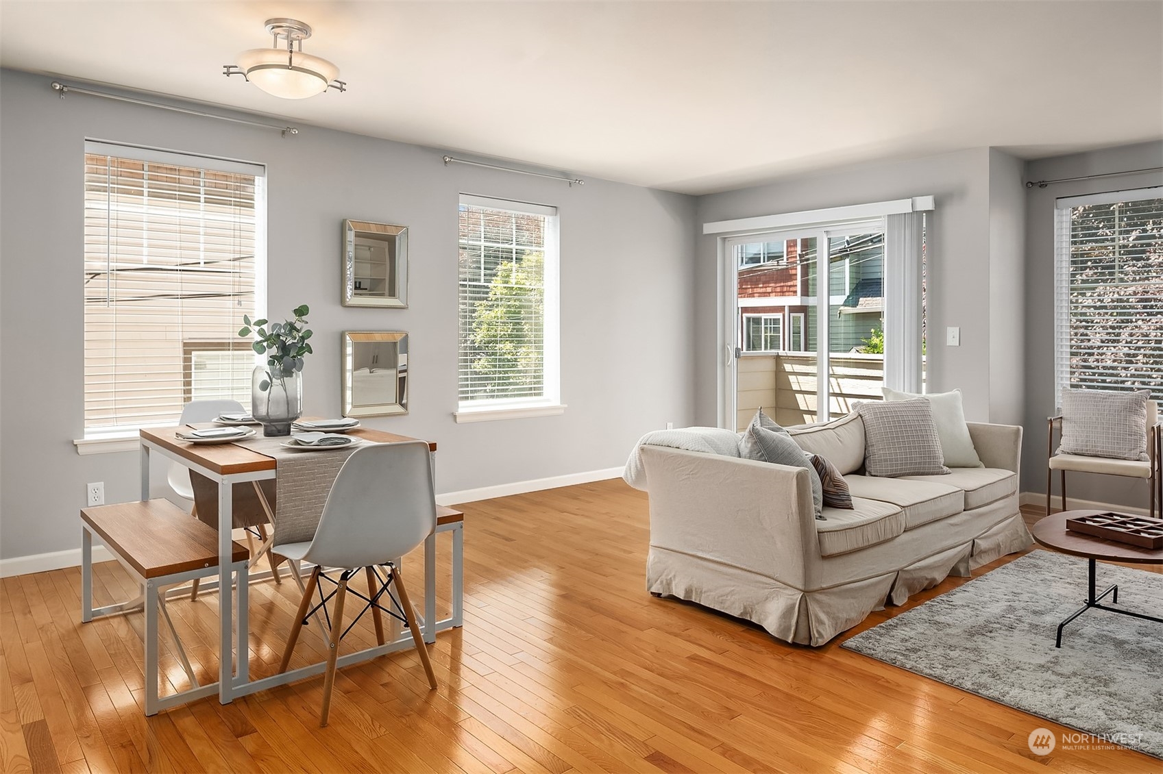 8517 Interlake Avenue North, Unit A Seattle, WA 98103 - Photo 5 of 20 a living room with furniture and windows