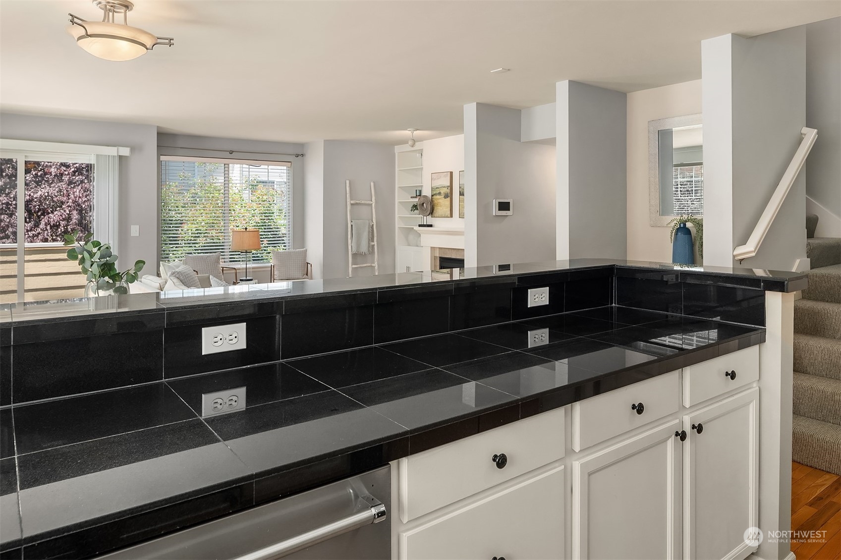 8517 Interlake Avenue North, Unit A Seattle, WA 98103 - Photo 10 of 20 a kitchen with granite countertop a sink and a large window