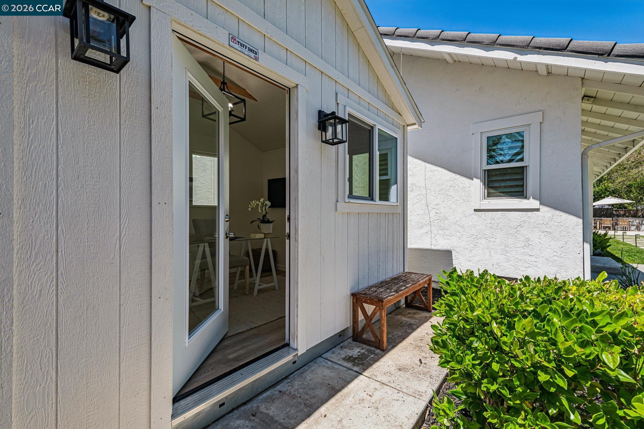 2941 Roundhill Road Alamo, CA 94507 - Photo 80 of 83 a view of a house with a potted plant and floor to ceiling window