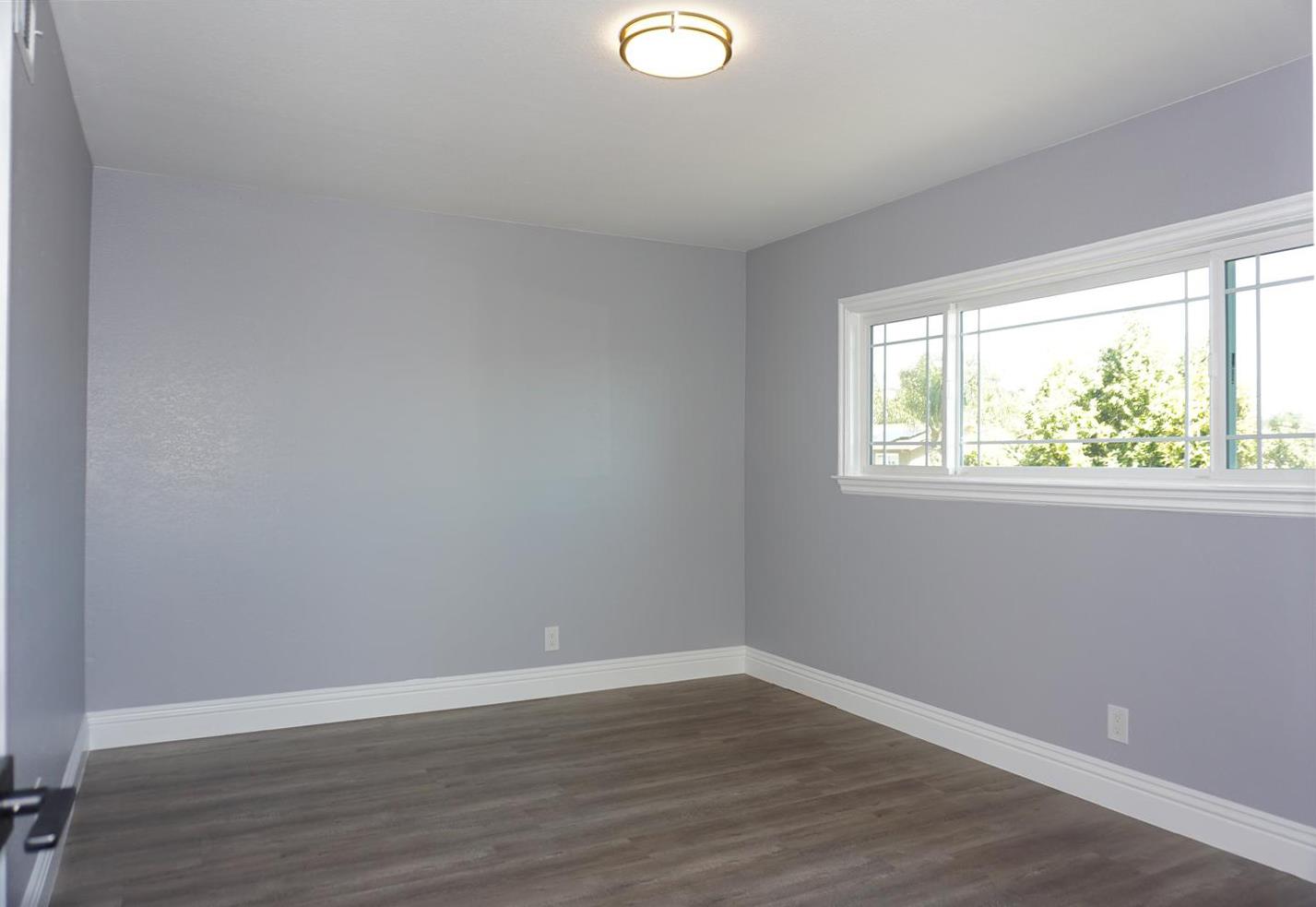 Kings Place Gilroy, CA 95020 - Photo 20 of 37 a view of a room with wooden floor and windows