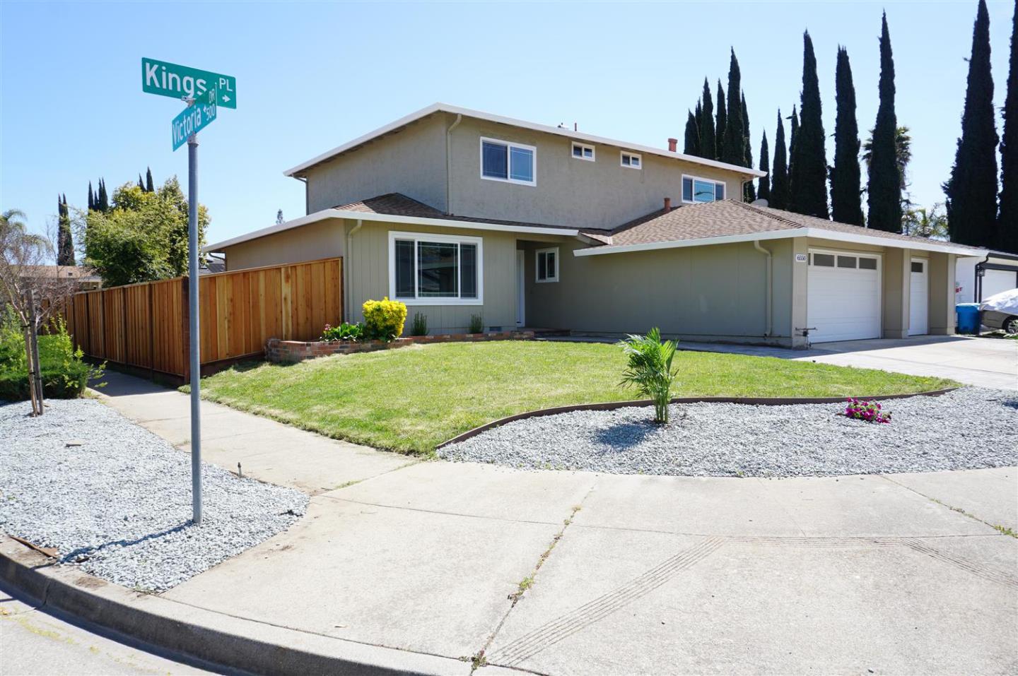Kings Place Gilroy, CA 95020 - Photo 2 of 37 a front view of a house with a yard and garage