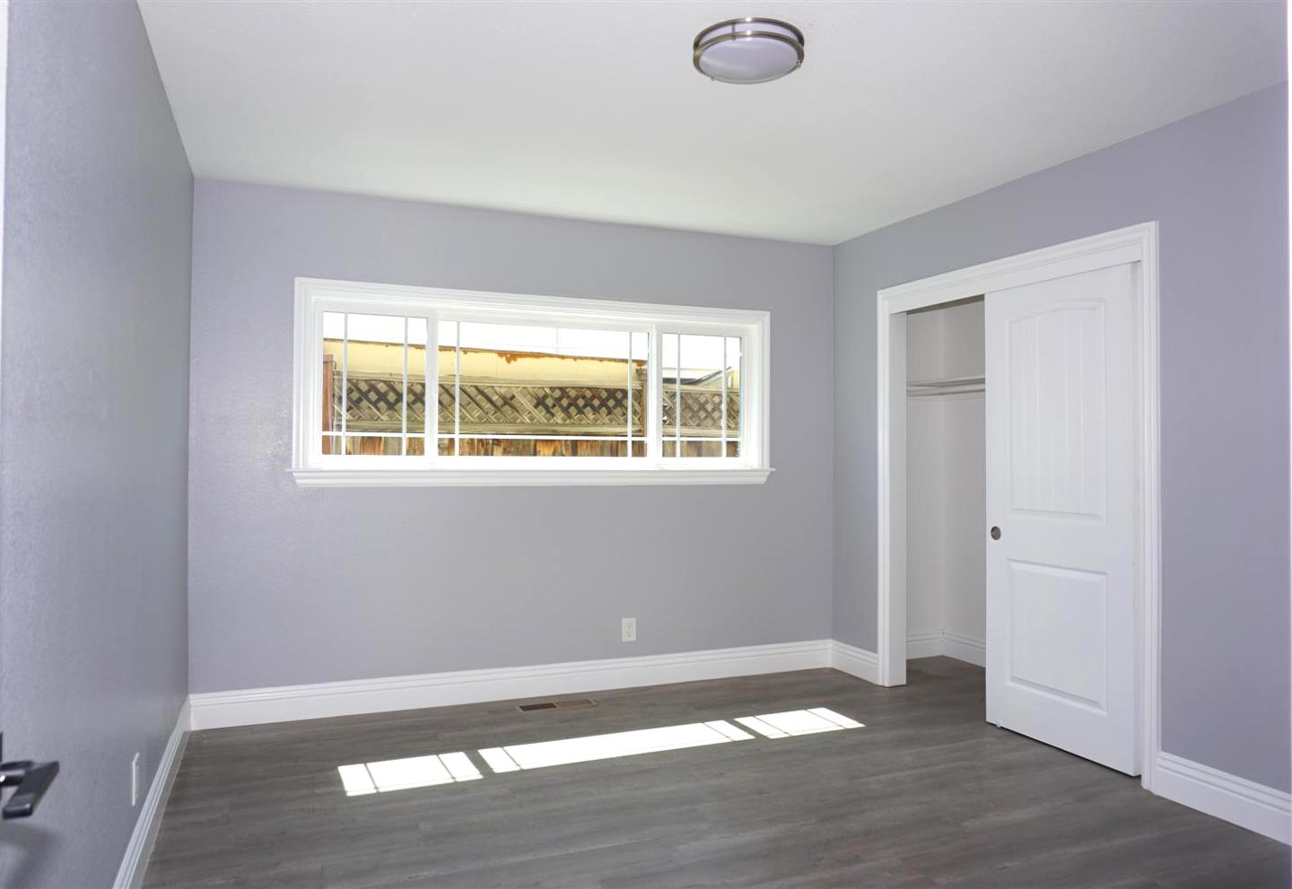 Kings Place Gilroy, CA 95020 - Photo 21 of 37 a view of an empty room with wooden floor and a window