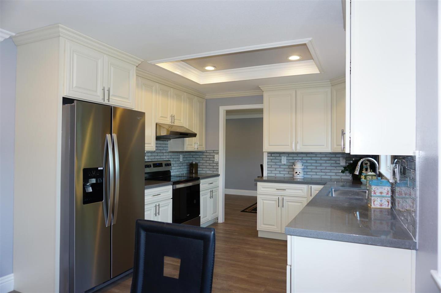 Kings Place Gilroy, CA 95020 - Photo 22 of 37 a kitchen with a refrigerator sink and stove