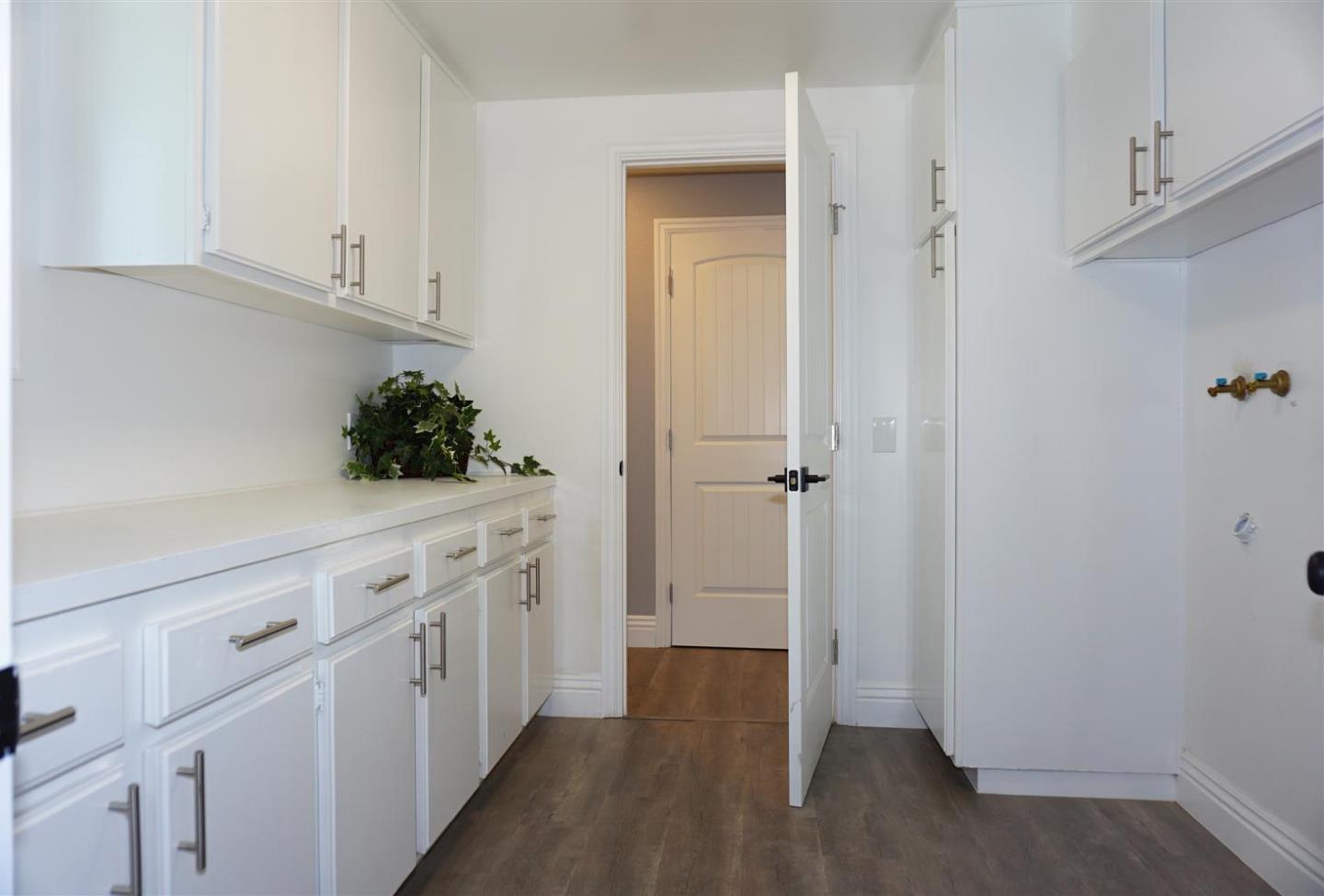 Kings Place Gilroy, CA 95020 - Photo 24 of 37 a view of a kitchen with white cabinets