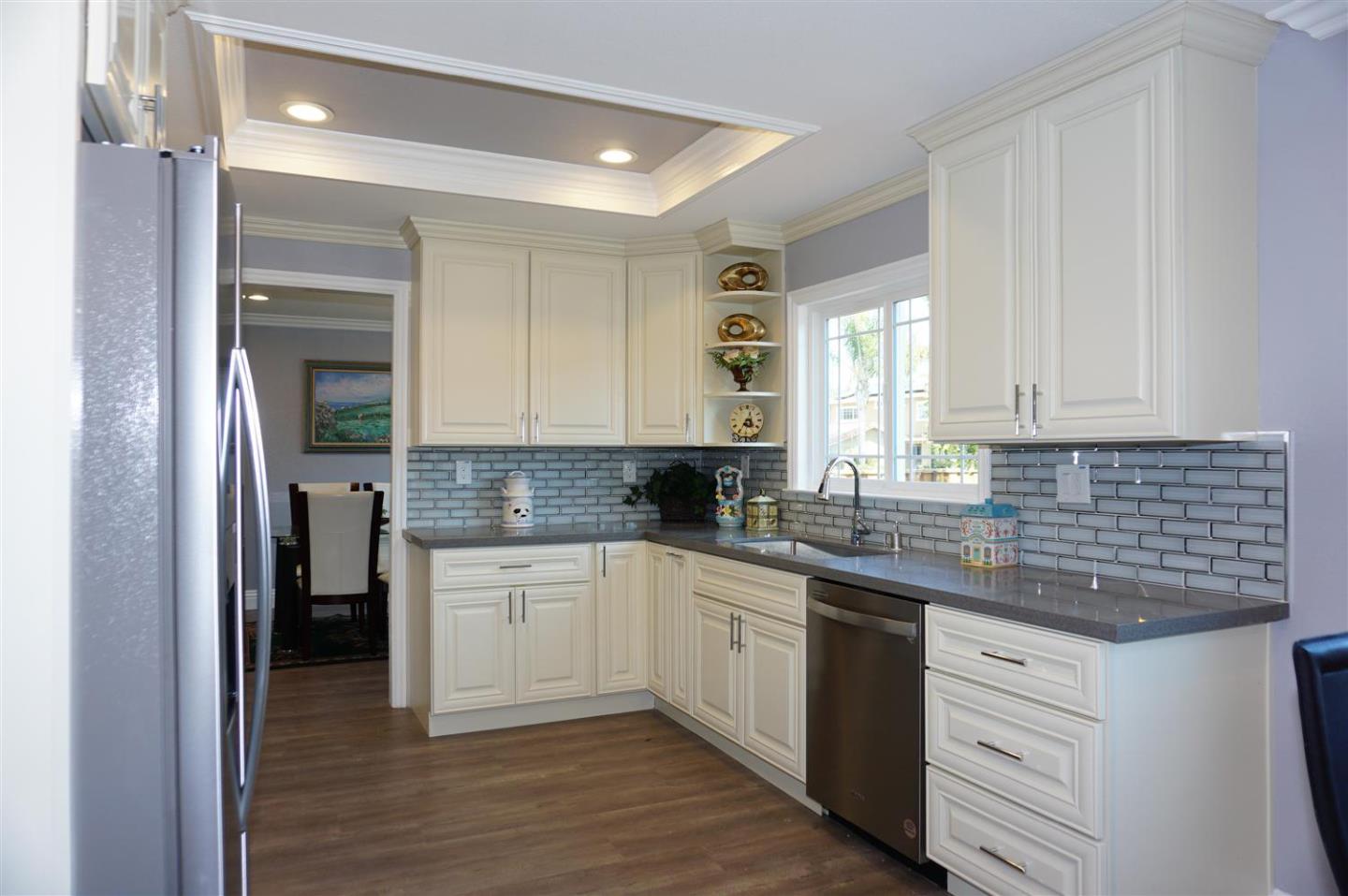 Kings Place Gilroy, CA 95020 - Photo 25 of 37 a kitchen with granite countertop white cabinets and white appliances