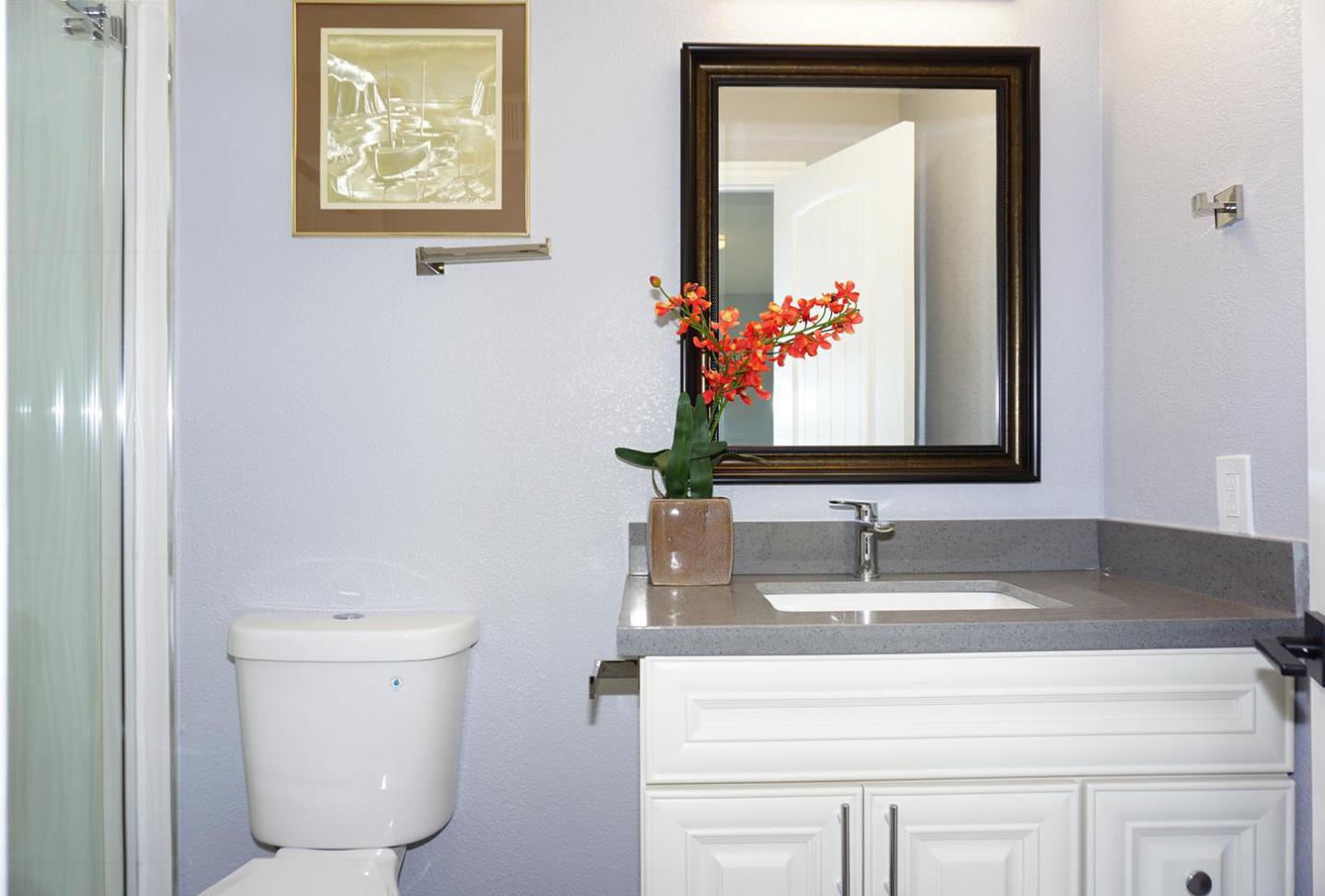 Kings Place Gilroy, CA 95020 - Photo 27 of 37 a bathroom with a sink and a mirror