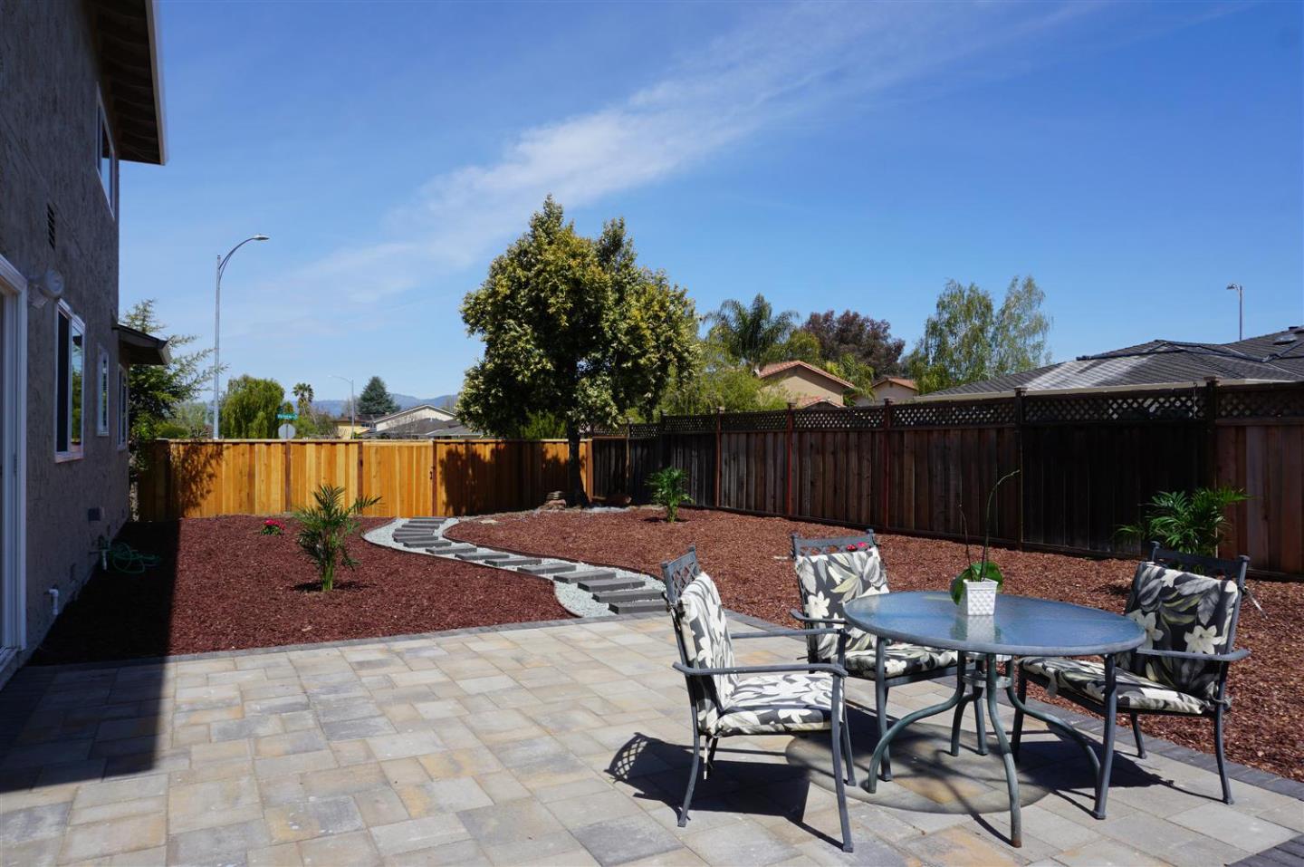 Kings Place Gilroy, CA 95020 - Photo 32 of 37 a view of backyard with seating space and trees in the background