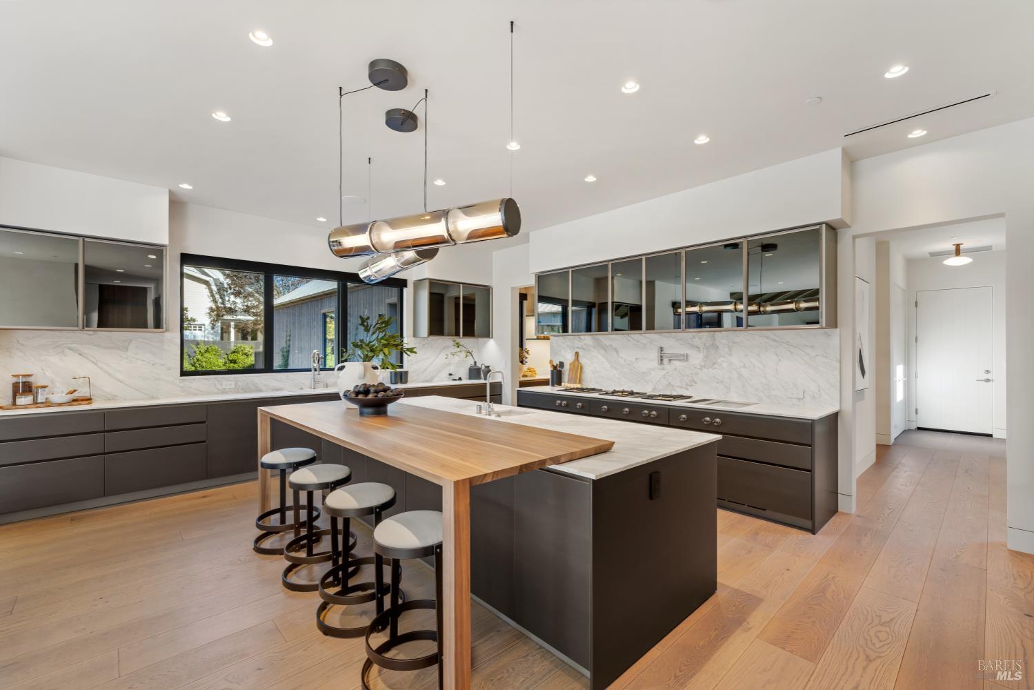 1590 McKinley Road Napa, CA 94558 - Photo 17 of 68 a large kitchen with a table and chairs