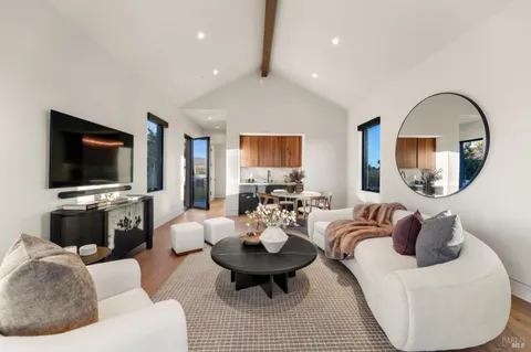 an aerial view of a house with a yard and a fountain