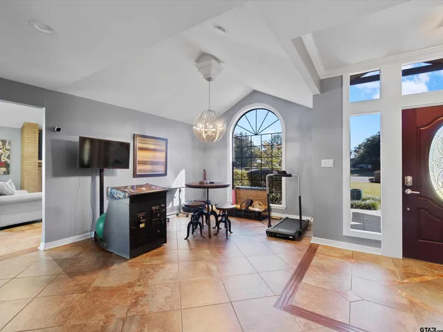 a living room with fireplace furniture and a flat screen tv
