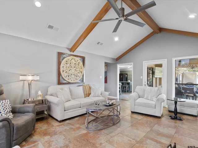 a living room with furniture and a table