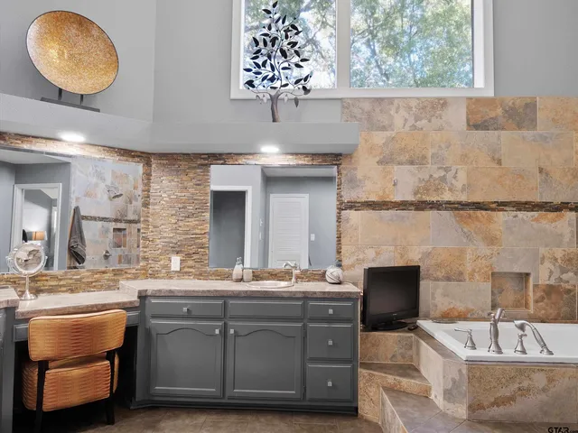 a bathroom with a sink and a mirror