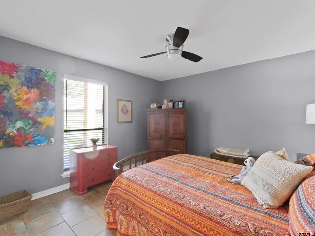 a bedroom with a bed and window