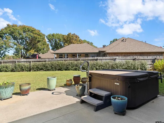 a view of a swimming pool with a patio