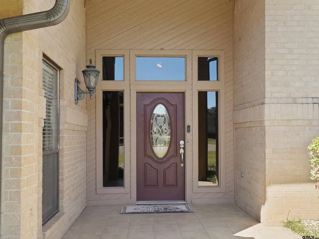 a front view of a house with large door