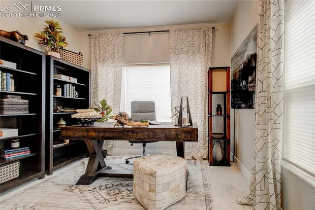 a view of a workspace with furniture