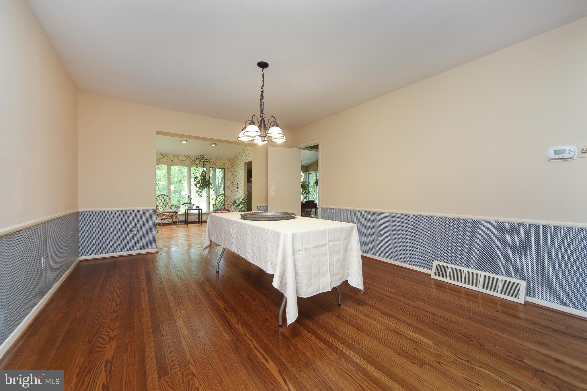 459 Wingate Road Huntingdon Valley, PA 19006 - Photo 12 of 31 a living room with couches and chandelier