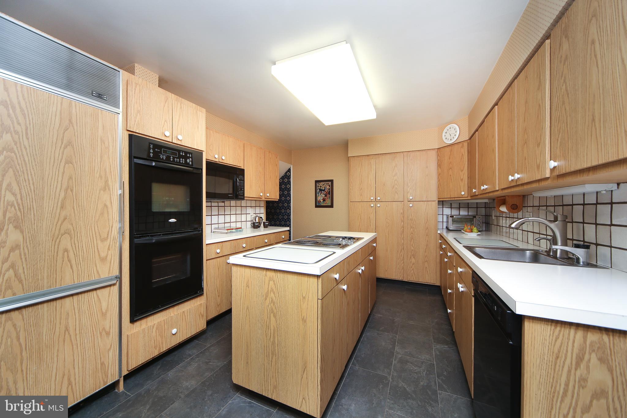 459 Wingate Road Huntingdon Valley, PA 19006 - Photo 15 of 31 a kitchen with a stove top oven and refrigerator