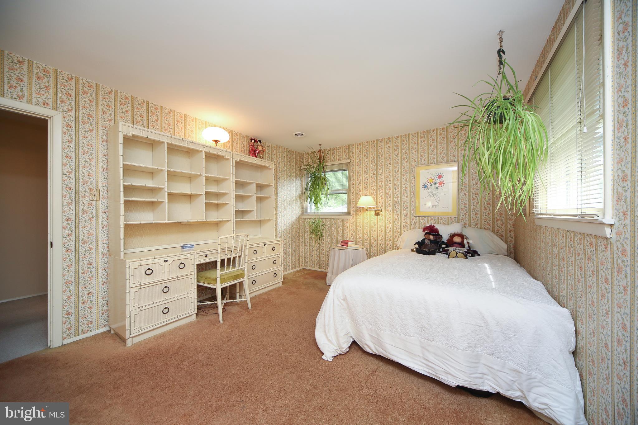 459 Wingate Road Huntingdon Valley, PA 19006 - Photo 20 of 31 a bedroom with a bed and a large window
