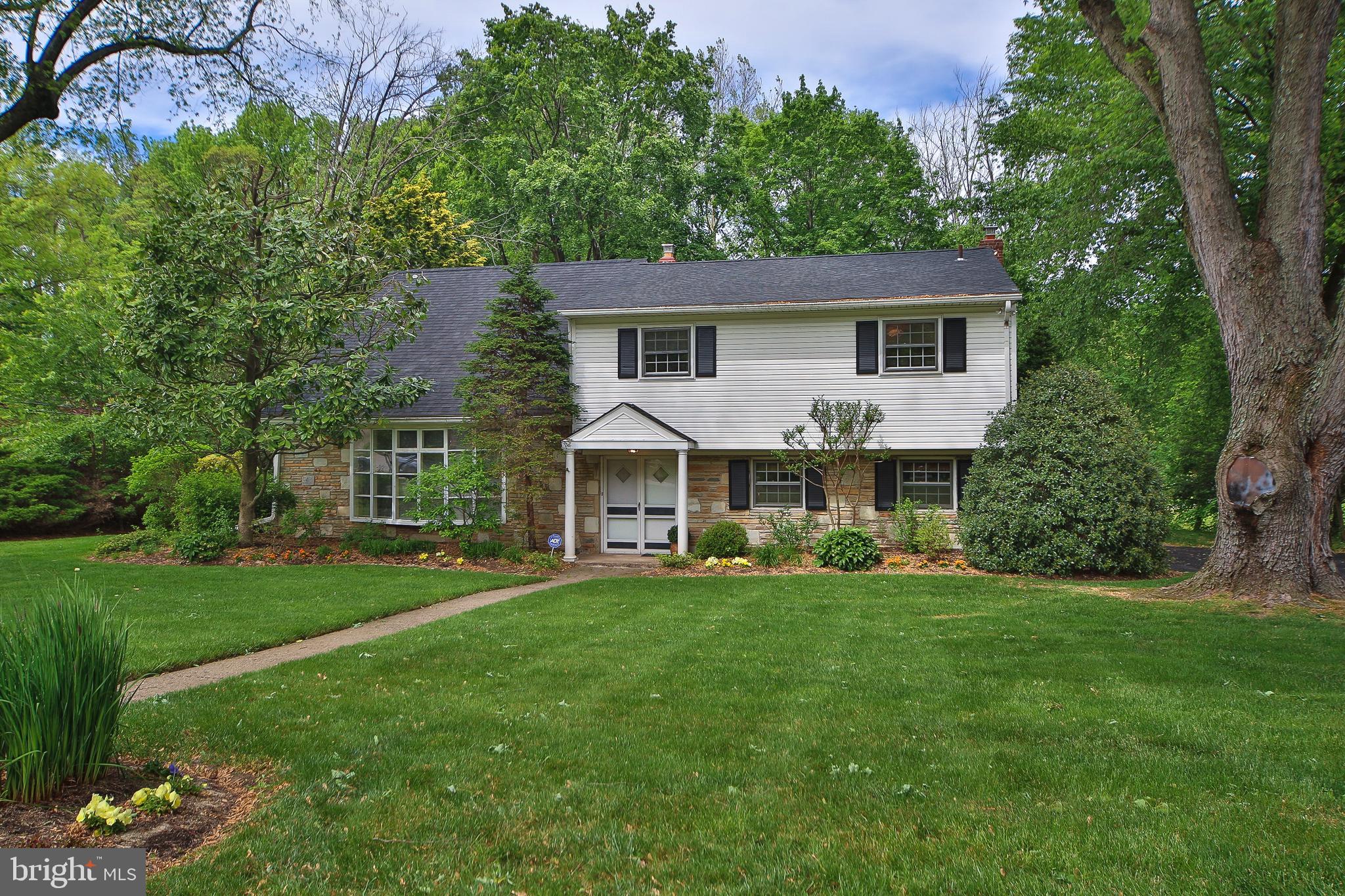 459 Wingate Road Huntingdon Valley, PA 19006 - Photo 3 of 31 a front view of a house with a garden